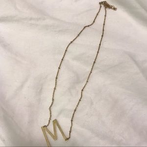 “M” gold necklace